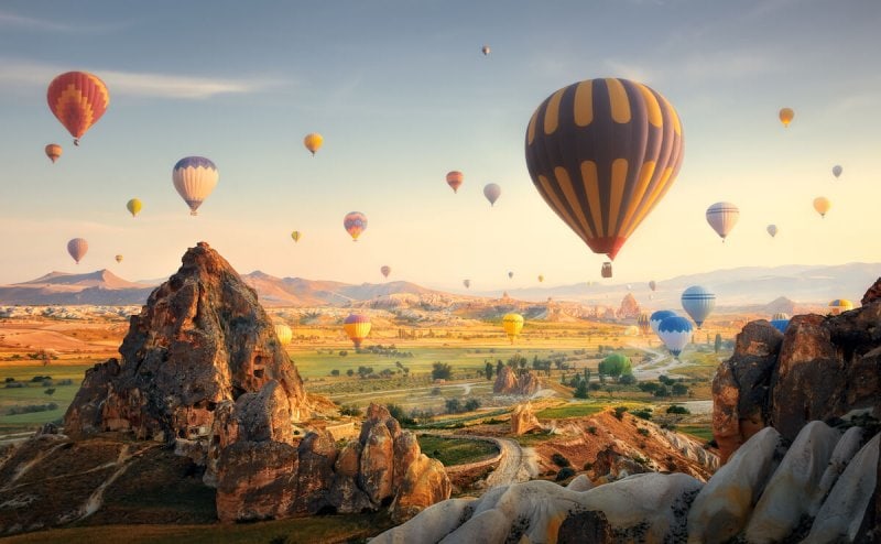 Hot air balloons flying over spectacular Cappadocia, Turkey