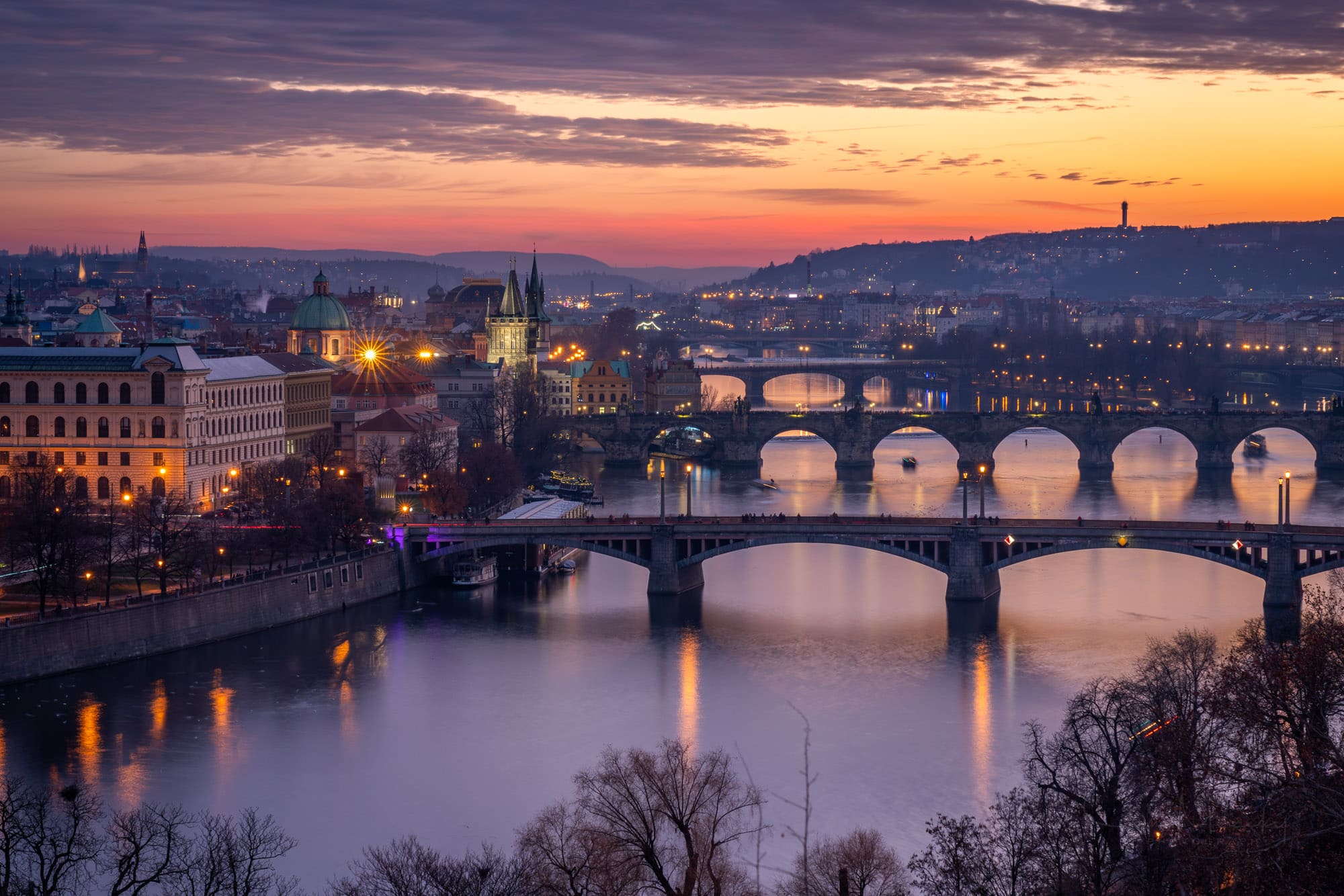 Prague skyline and bridges at sunset